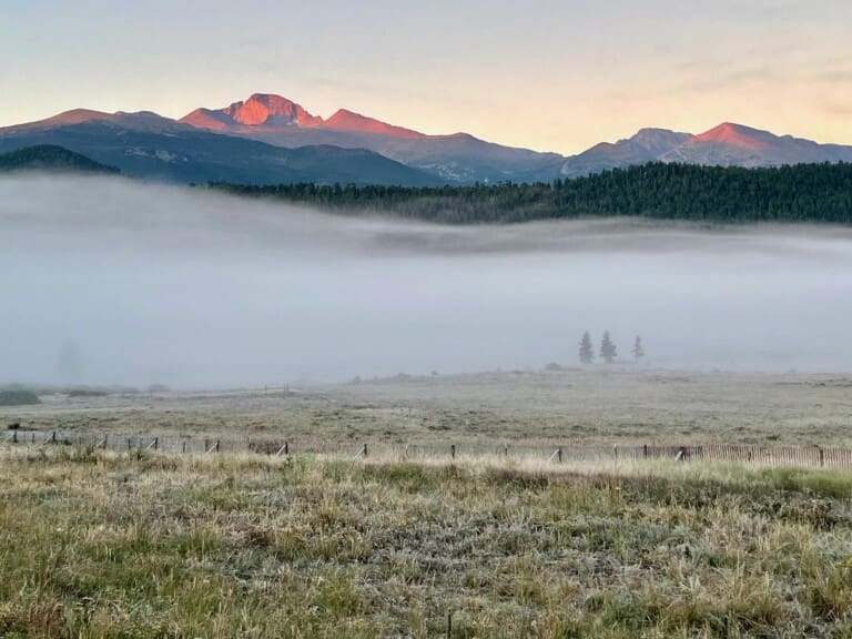 First light on Longs Peak from Beaver Meadows minutes from This Mountain Life